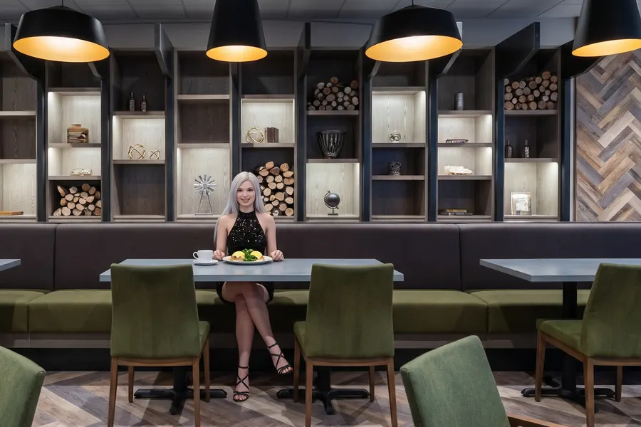 A woman at a table in the Casino Regina restaurant